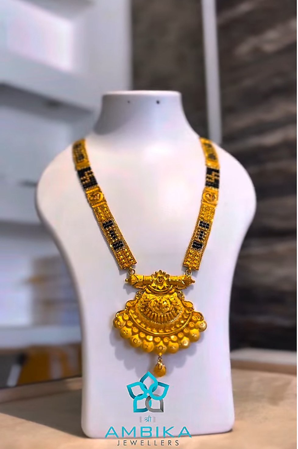 Long gold mangalsutra with large pendant