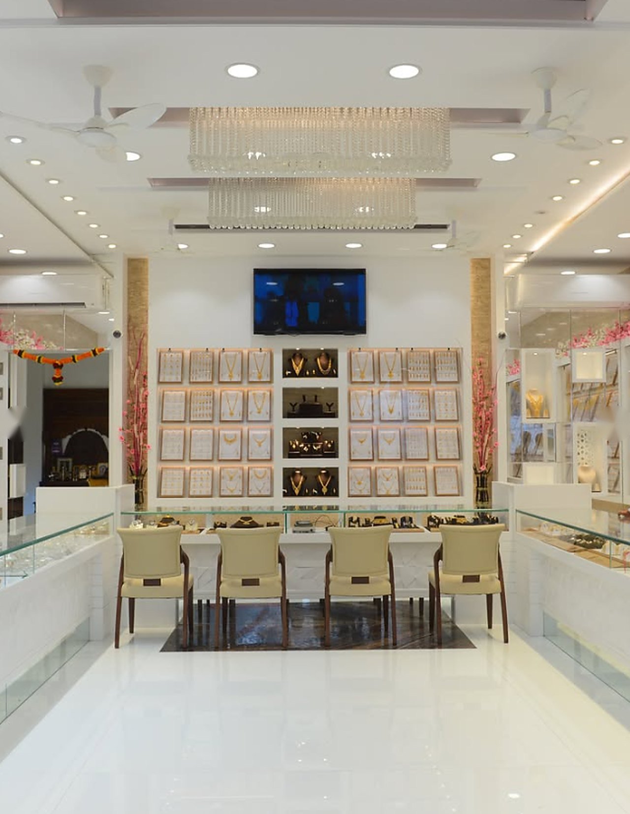 Inside Ambika Jewellers showroom with wall displays and counters